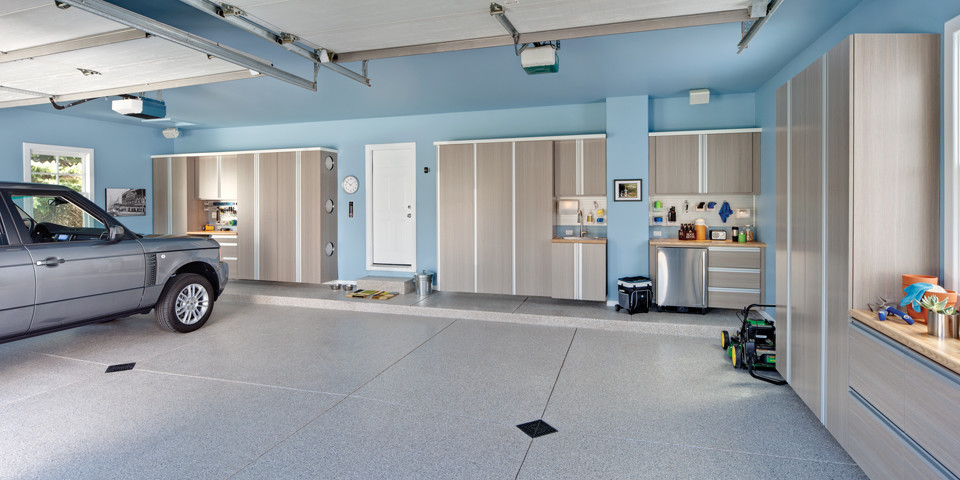 Example of a mid-sized transitional two-car garage workshop design in Cleveland