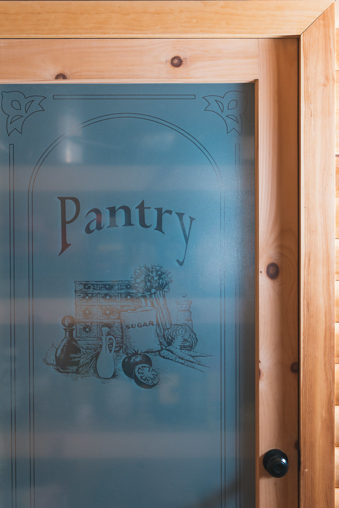 Inspiration for a mid-sized rustic l-shaped dark wood floor and brown floor kitchen pantry remodel with raised-panel cabinets, medium tone wood cabinets, laminate countertops, multicolored backsplash, stainless steel appliances, a peninsula and beige countertops