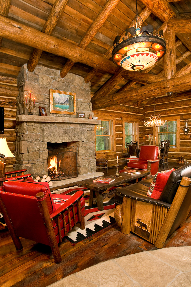 Mountain style formal living room photo in Other with a standard fireplace and a stone fireplace