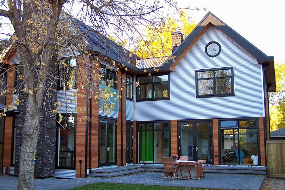 Mid-sized contemporary two-storey exterior in Calgary.