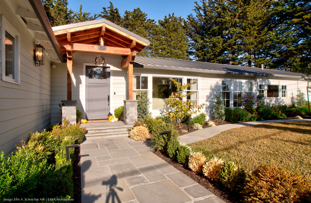 Example of a small transitional white one-story wood and clapboard exterior home design in San Francisco with a metal roof and a gray roof
