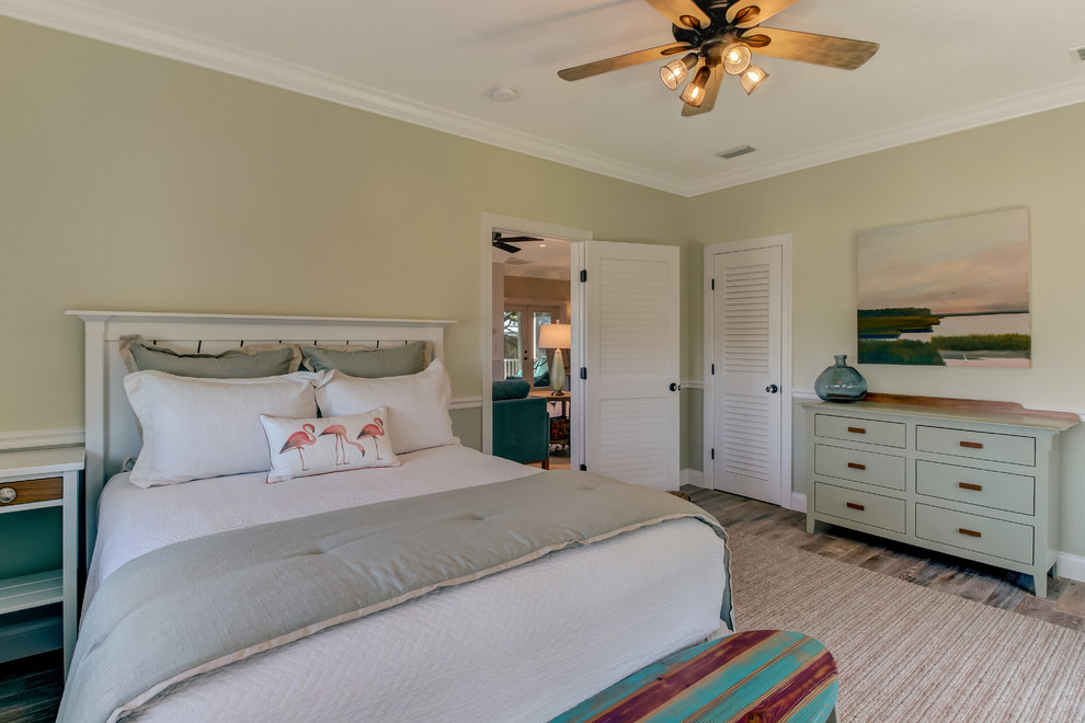 Design ideas for a beach style bedroom in Jacksonville with porcelain floors.