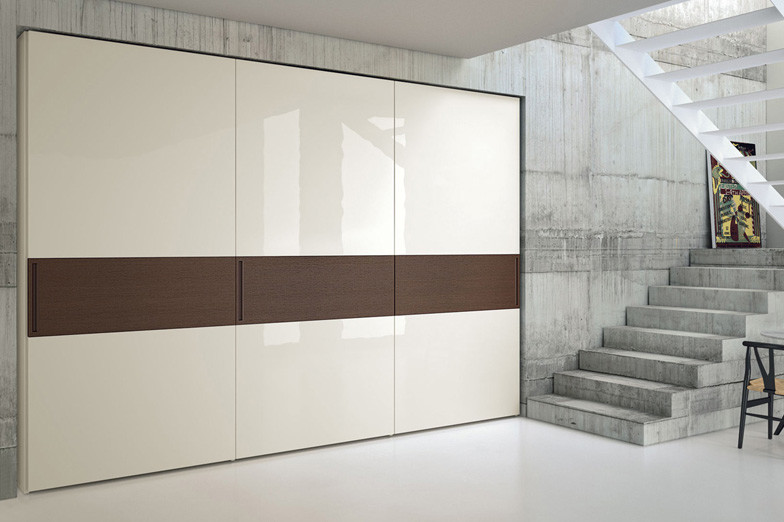 Inspiration for a large modern foyer in New York with grey walls and concrete floors.