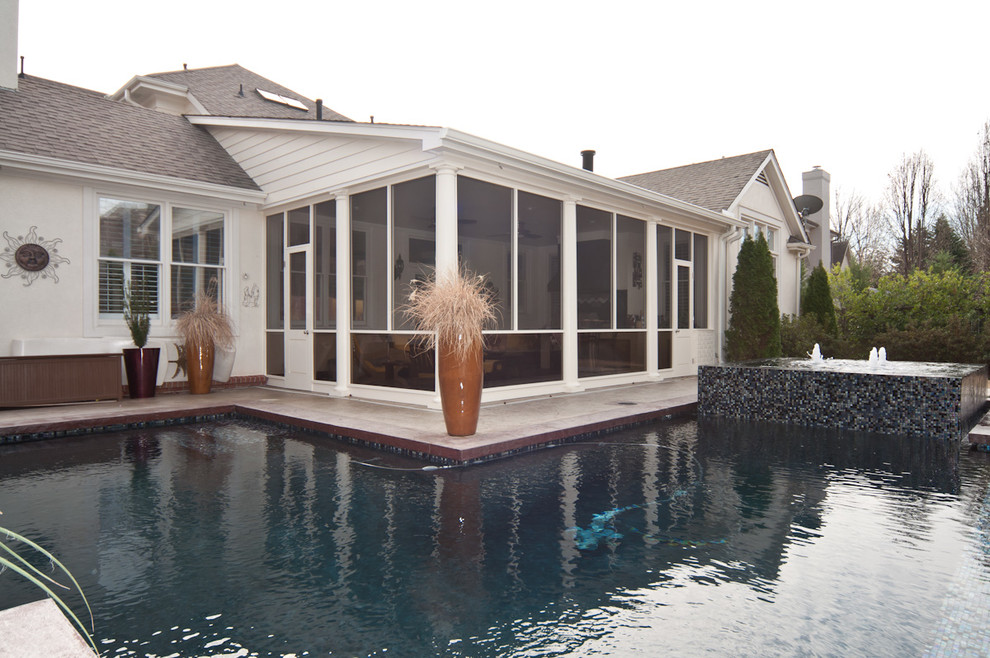 Mid-sized backyard concrete paver and l-shaped natural pool fountain photo