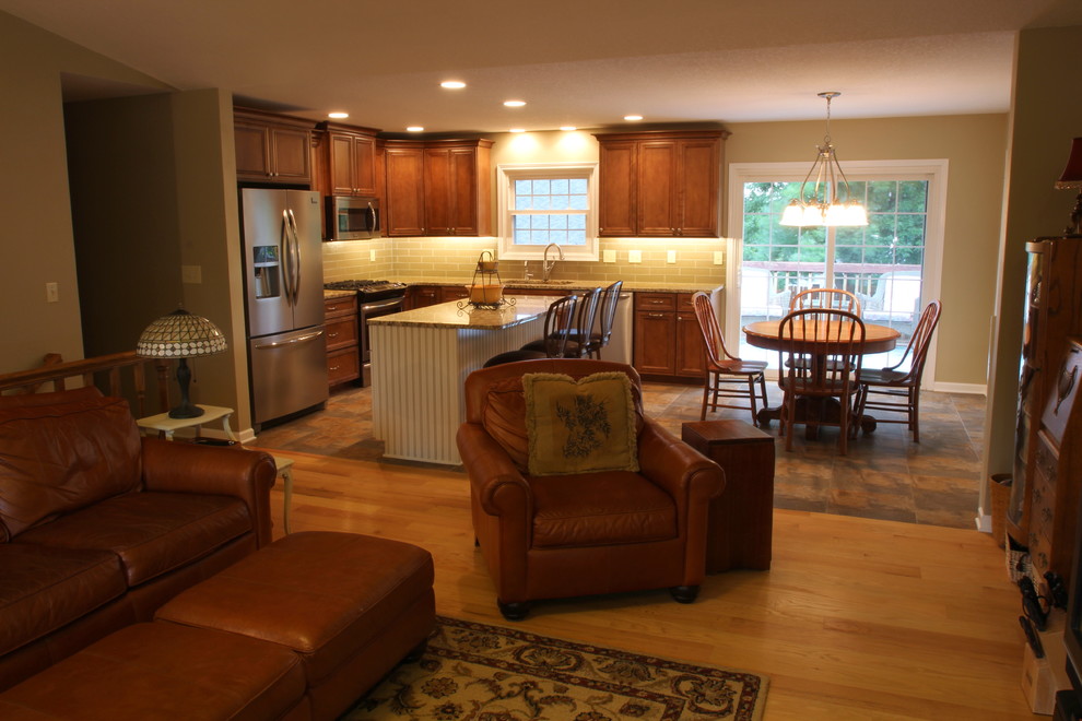 Mid-sized elegant formal and open concept light wood floor home design photo with beige walls, a standard fireplace, a stone fireplace and a tv stand
