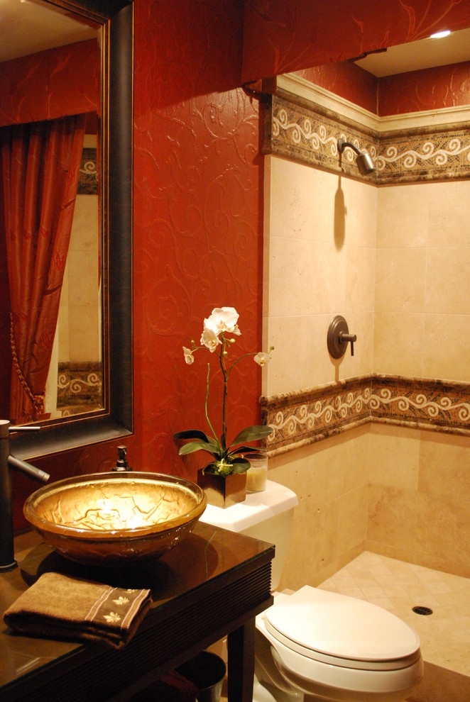 Photo of a small mediterranean bathroom in Orange County with a vessel sink, open cabinets, dark wood cabinets, wood benchtops, an alcove shower, a two-piece toilet, beige tile, stone tile, red walls and travertine floors.
