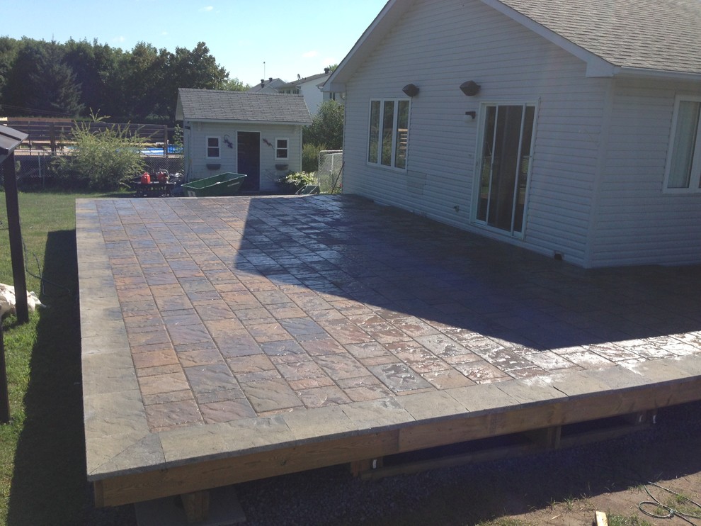 Deck - huge transitional backyard deck idea in Toronto