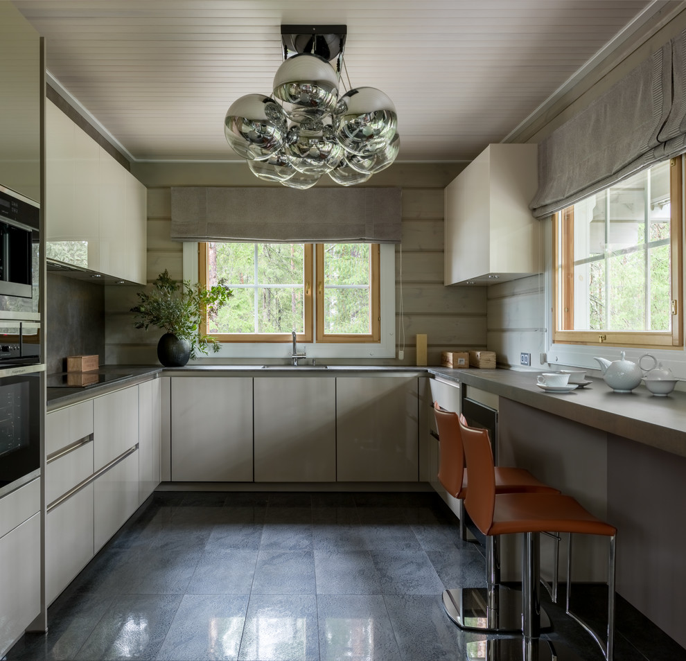 Photo of a mid-sized contemporary u-shaped separate kitchen in Saint Petersburg with flat-panel cabinets, grey cabinets, quartz benchtops, porcelain floors, no island, black floor, grey splashback and black appliances.