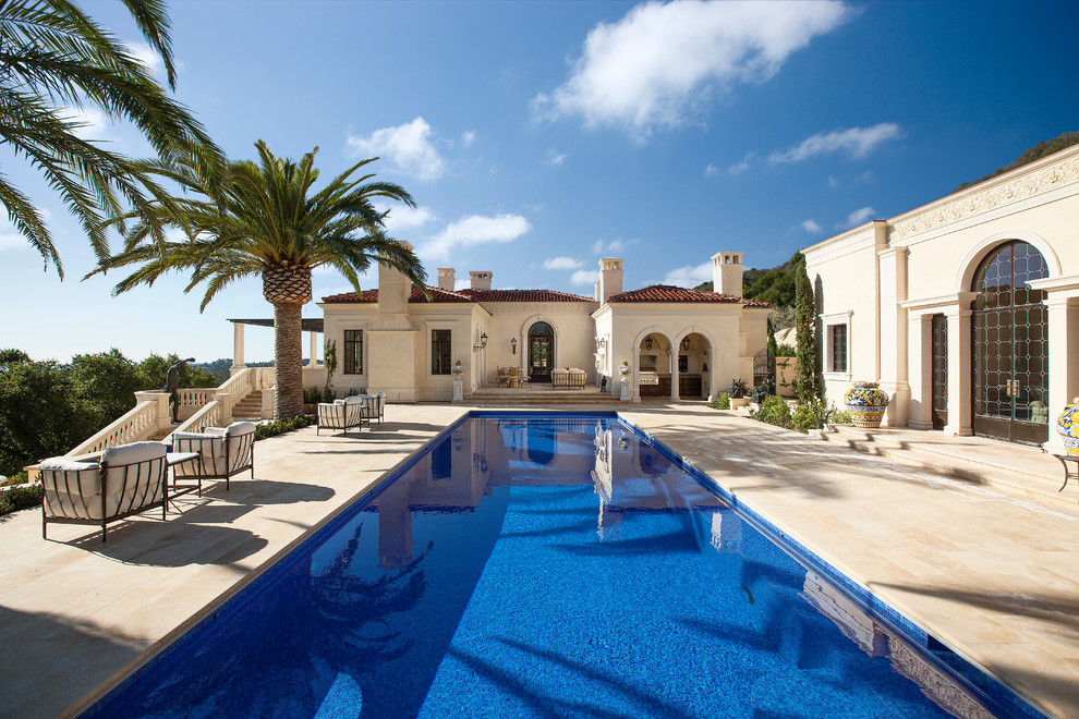 This is an example of a mediterranean courtyard rectangular pool in Santa Barbara.
