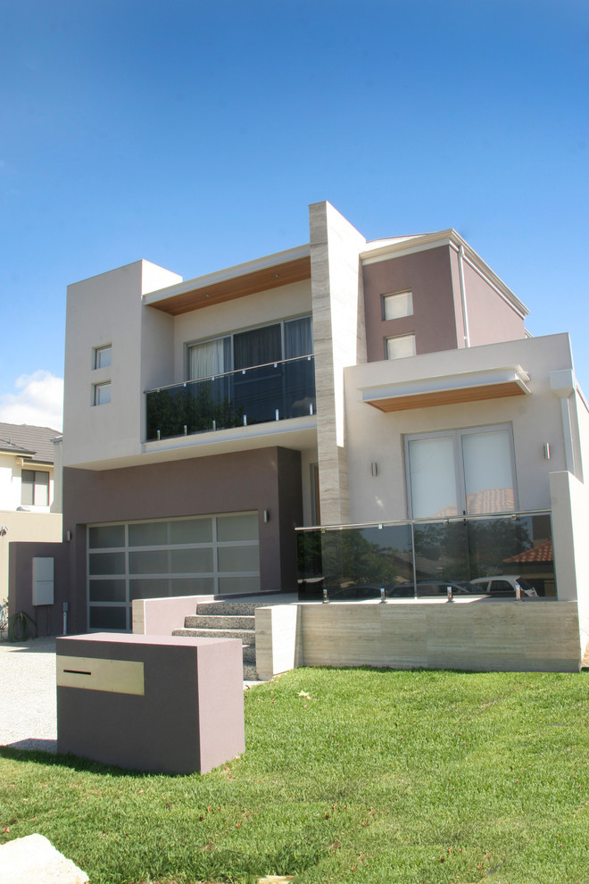 Inspiration for a large contemporary two-storey beige house exterior in Perth with stone veneer, a gable roof and a metal roof.