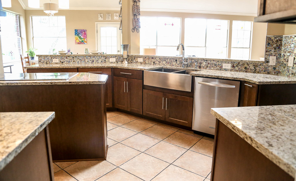 Eat-in kitchen - mid-sized transitional single-wall porcelain tile and beige floor eat-in kitchen idea in Austin with a farmhouse sink, shaker cabinets, dark wood cabinets, glass countertops, multicolored backsplash, glass tile backsplash, stainless steel appliances, an island and multicolored countertops