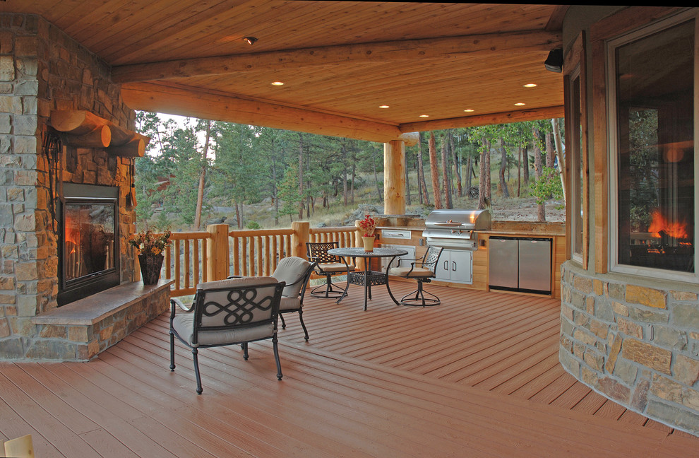 Deck - mid-sized rustic backyard deck idea in Sacramento with a roof extension