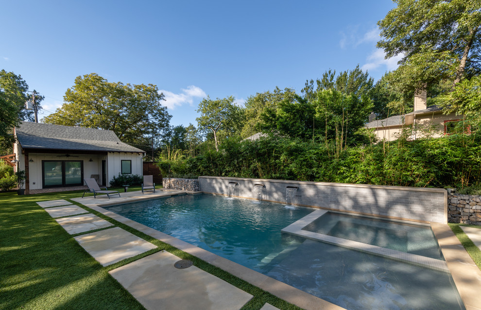 Design ideas for a mid-sized transitional backyard rectangular pool in Dallas with concrete slab.