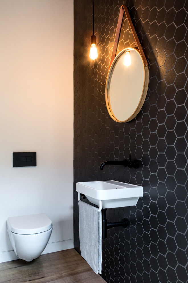 Photo of a contemporary powder room in Melbourne.