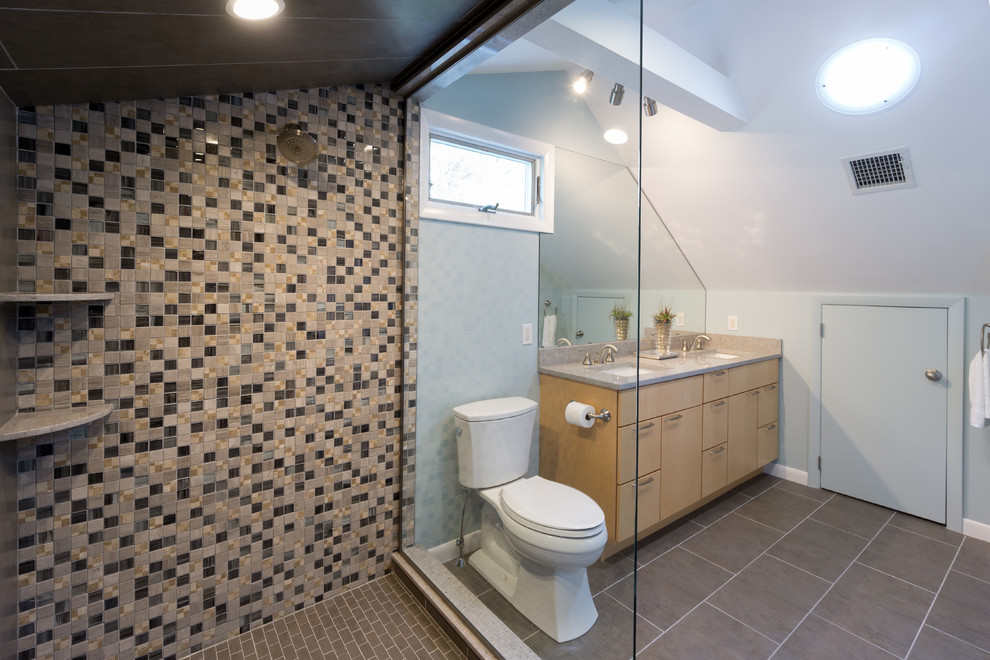 Inspiration for a mid-sized modern master bathroom in Providence with flat-panel cabinets, light wood cabinets, engineered quartz benchtops, gray tile, porcelain tile, an open shower, a two-piece toilet, blue walls, porcelain floors and an undermount sink.