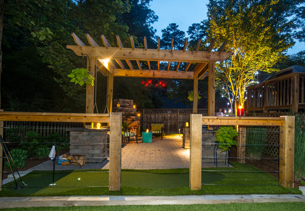 Patio - mid-sized traditional backyard brick patio idea in Raleigh with a fire pit and a pergola