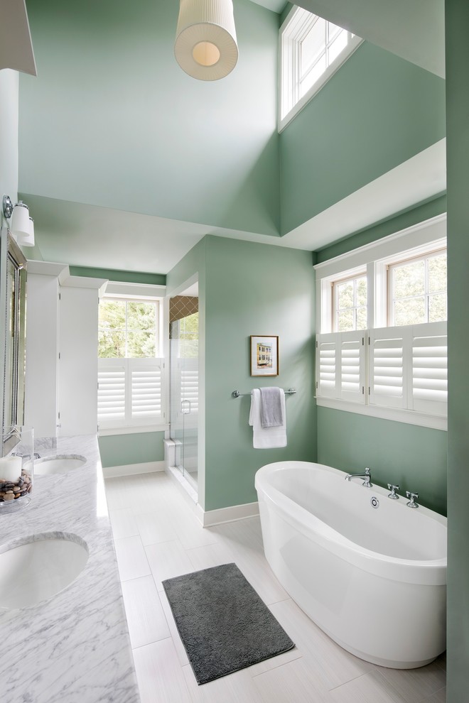 Large contemporary master bathroom in Baltimore with a japanese tub, an alcove shower, green walls, ceramic floors, a drop-in sink, marble benchtops, white floor, a hinged shower door and grey benchtops.
