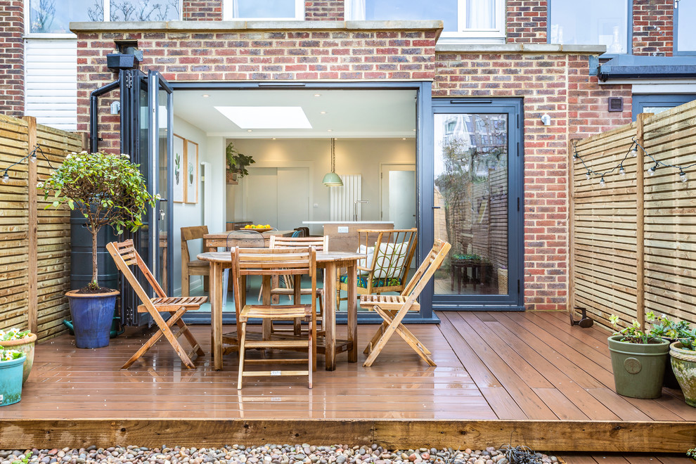 Design ideas for a contemporary backyard deck in London with no cover.