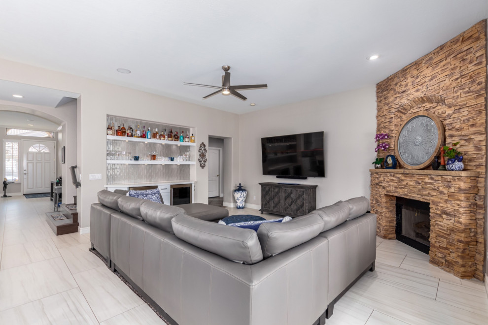 Transitional kitchen photo in Phoenix with a farmhouse sink, shaker cabinets, white cabinets, gray backsplash, stainless steel appliances and white countertops
