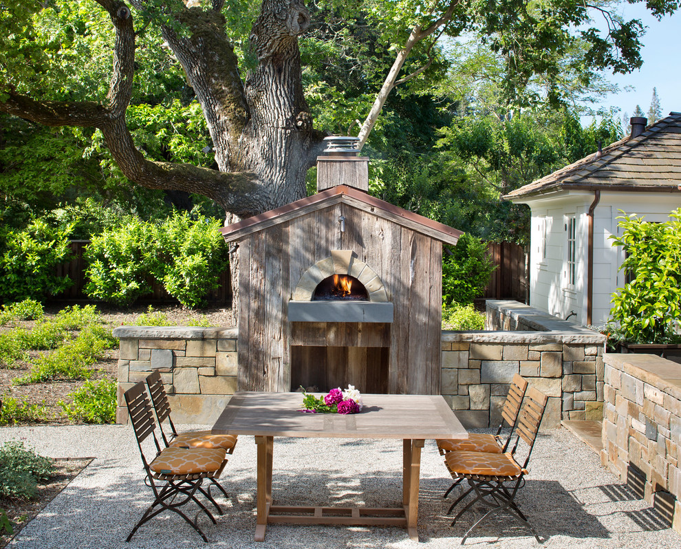 Inspiration for a traditional backyard patio in San Francisco with gravel, no cover and a fire feature.
