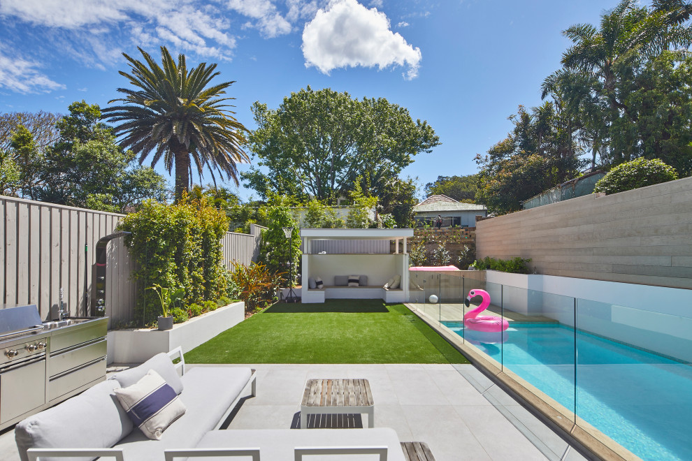Inspiration for a contemporary backyard patio in Sydney with no cover.