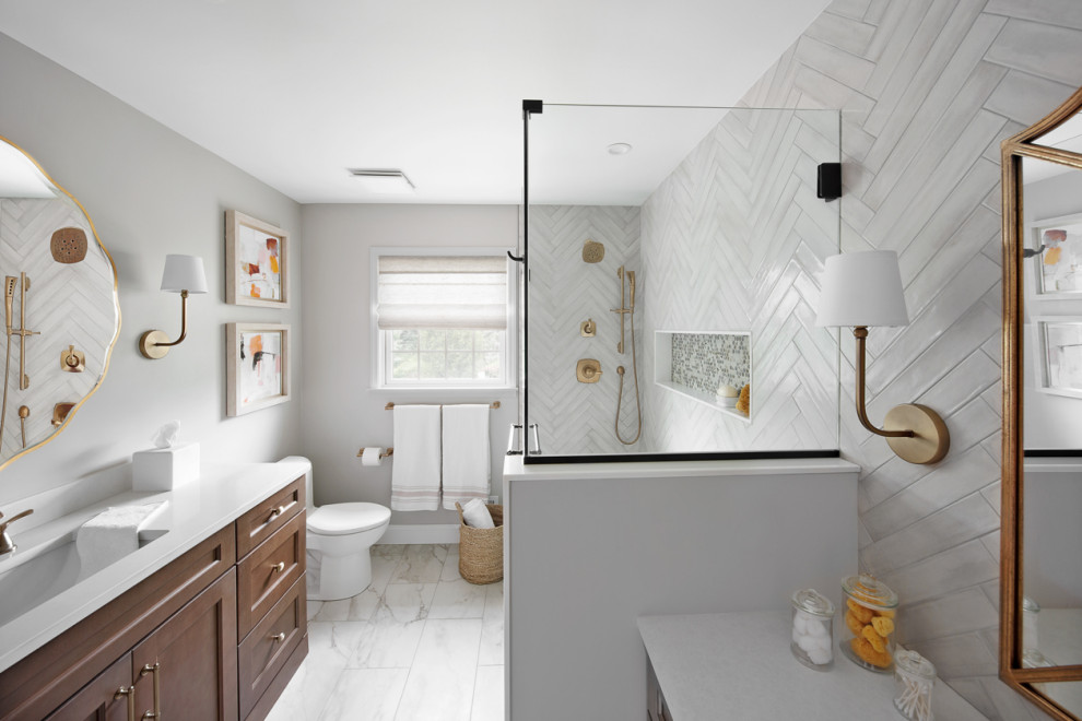 Design ideas for a medium sized classic family bathroom in Philadelphia with raised-panel cabinets, medium wood cabinets, a one-piece toilet, white tiles, ceramic tiles, a submerged sink, quartz worktops, white worktops, a single sink, a built in vanity unit, ceramic flooring, white floors, a hinged door, a wall niche and grey walls.