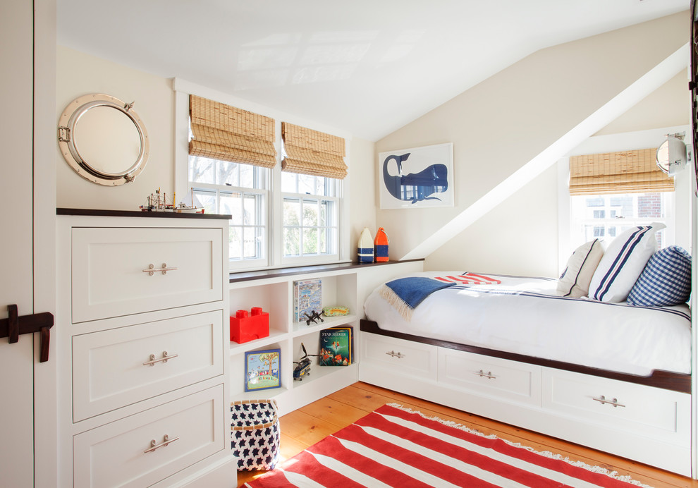 Inspiration for a bedroom coastal medium tone wood floor kids' bedroom remodel in Boston with white walls