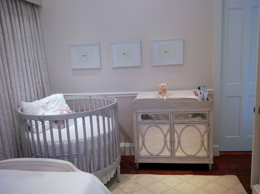 Mid-sized contemporary nursery in Miami with beige walls and medium hardwood floors for girls.