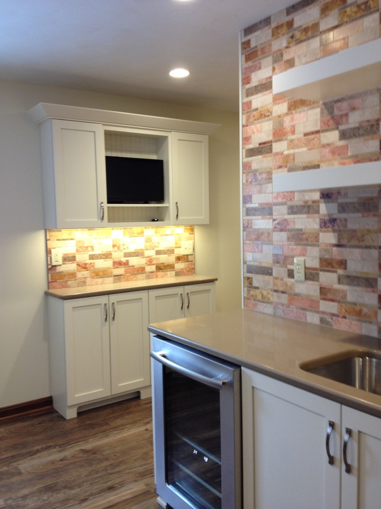 Mid-sized transitional l-shaped utility room photo with an undermount sink, shaker cabinets, white cabinets, quartz countertops, beige walls and a side-by-side washer/dryer