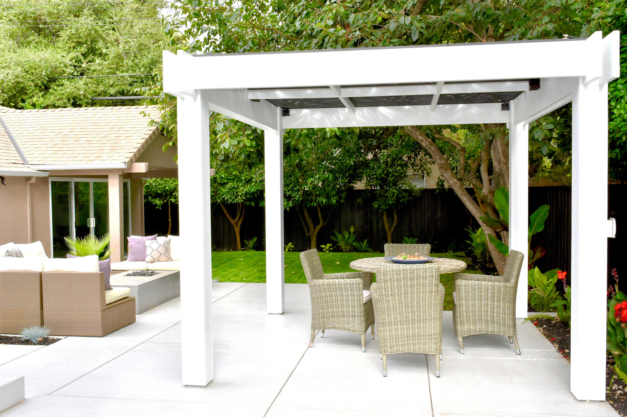 Custom Pergola with Artistic Cut-Out Trellis and Inviting Outdoor Spaces