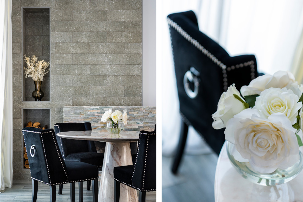 Foto de comedor contemporáneo grande abierto con paredes blancas, suelo de baldosas de porcelana, todas las chimeneas, piedra de revestimiento, suelo gris y ladrillo
