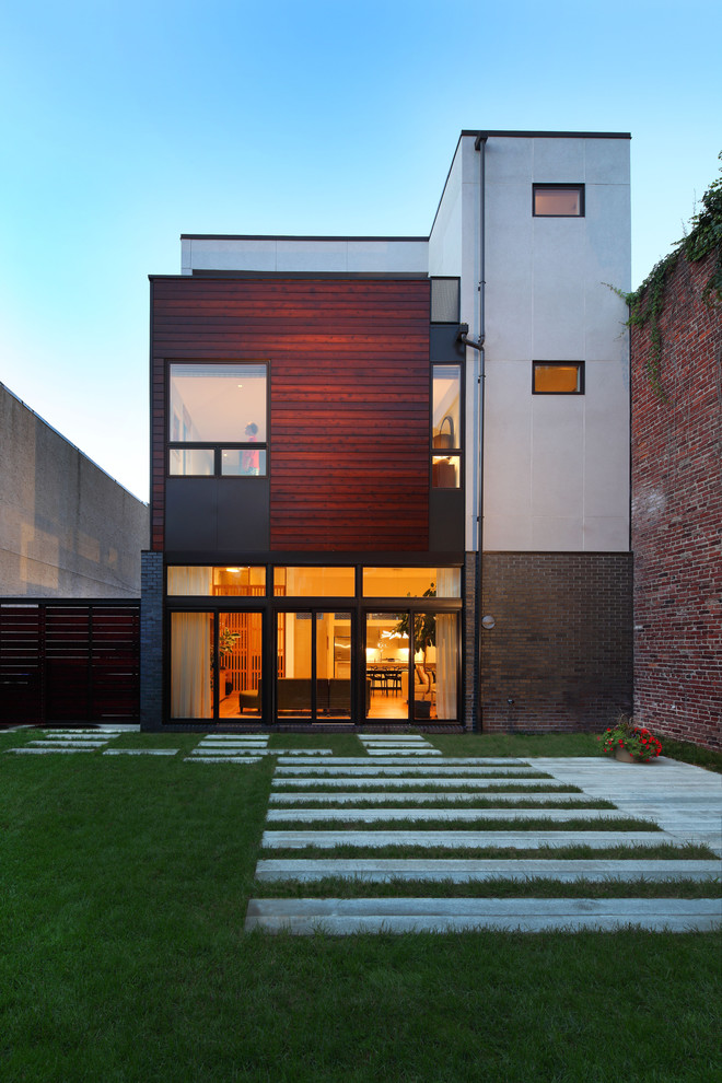 This is an example of a contemporary exterior in Philadelphia with wood siding.