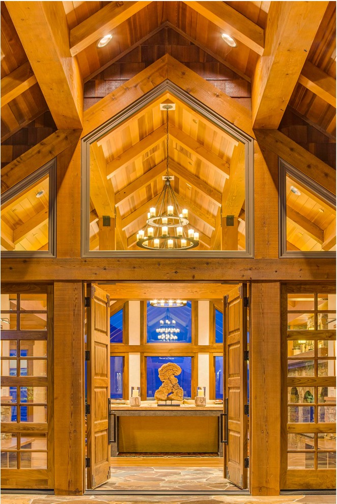 Mountain style double front door photo with a medium wood front door