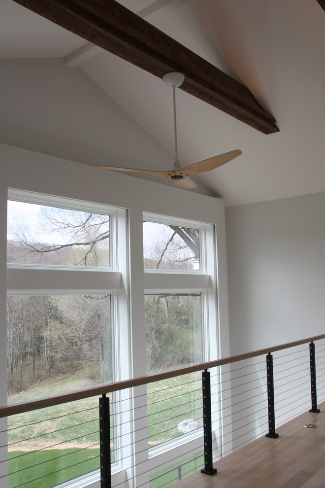Example of a large transitional loft-style light wood floor and beige floor home design design in Bridgeport with blue walls