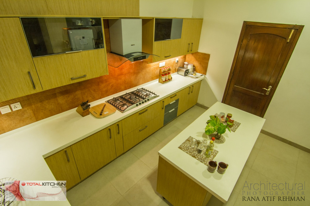 Design ideas for a mid-sized contemporary u-shaped separate kitchen in Other with a double-bowl sink, flat-panel cabinets, medium wood cabinets, laminate benchtops, brown splashback, ceramic splashback, stainless steel appliances, ceramic floors and with island.