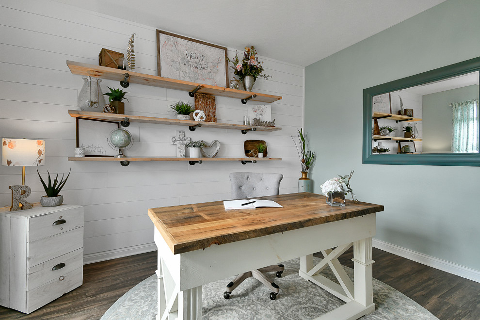 This is an example of a medium sized farmhouse study in Columbus with grey walls, vinyl flooring, a freestanding desk, brown floors and tongue and groove walls.