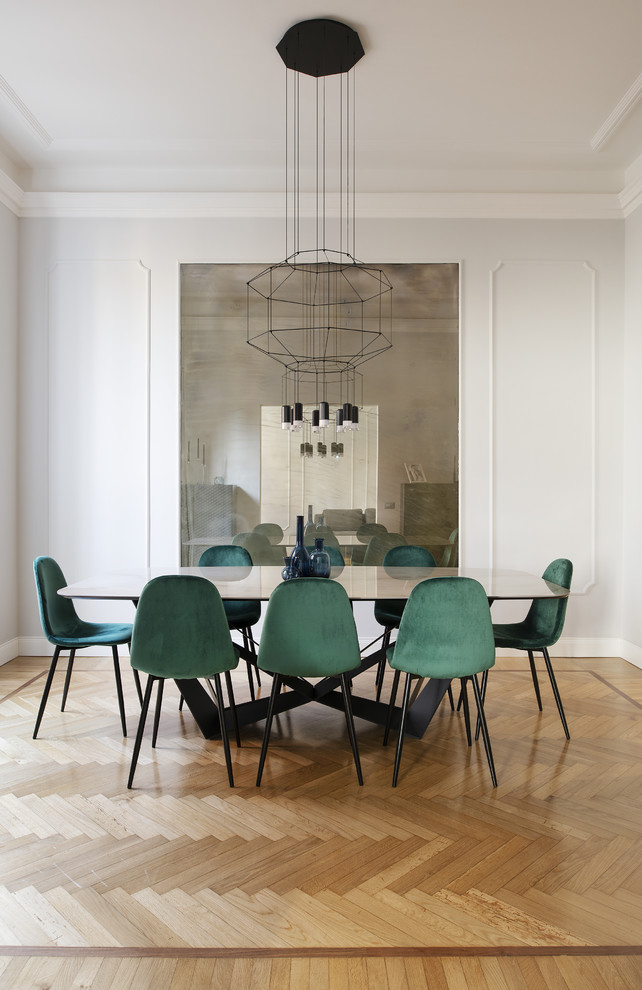 Inspiration for a contemporary dining room in Rome with grey walls, light hardwood floors and no fireplace.