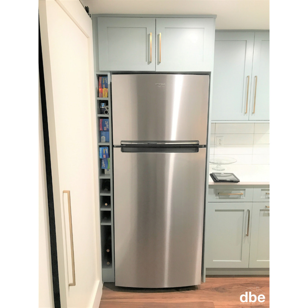 Kitchen - small transitional galley vinyl floor and brown floor kitchen idea with a farmhouse sink, shaker cabinets, blue cabinets, quartz countertops, white backsplash, subway tile backsplash, stainless steel appliances, no island and white countertops