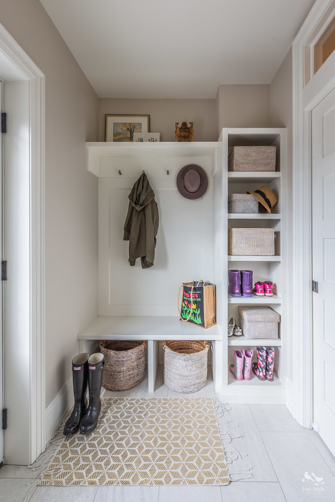 Inspiration for a small transitional porcelain tile mudroom remodel in Toronto with gray walls