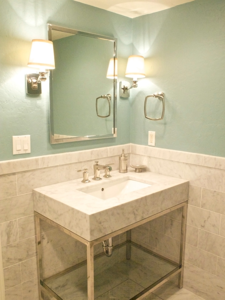 Mid-sized modern powder room in San Francisco with an undermount sink, marble benchtops, a one-piece toilet, white tile, gray tile, stone tile, white walls, marble floors and open cabinets.