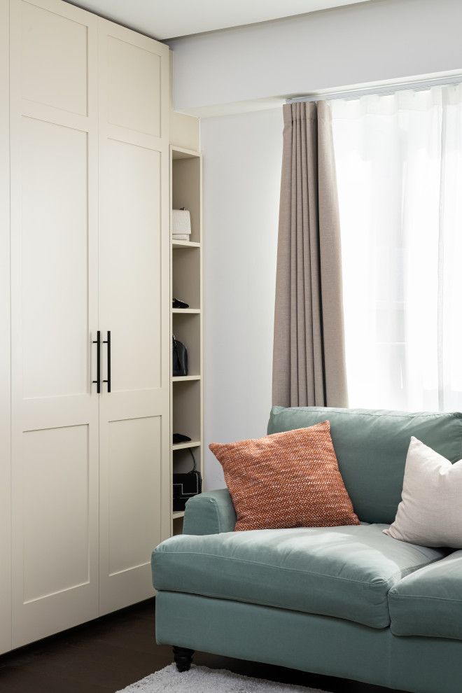 Medium sized scandi guest bedroom in London with white walls, vinyl flooring and brown floors.