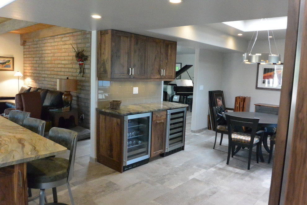 Inspiration for a huge transitional l-shaped porcelain tile and gray floor open concept kitchen remodel with an undermount sink, shaker cabinets, medium tone wood cabinets, quartzite countertops, white backsplash, porcelain backsplash, paneled appliances, an island and green countertops