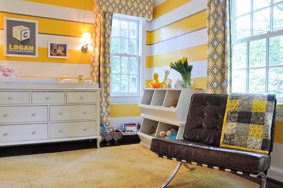 Design ideas for a transitional gender-neutral nursery in DC Metro with yellow walls and dark hardwood floors.