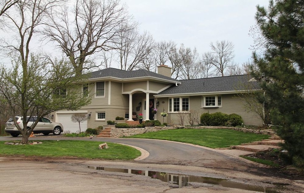 Example of a small transitional green split-level mixed siding exterior home design in Chicago
