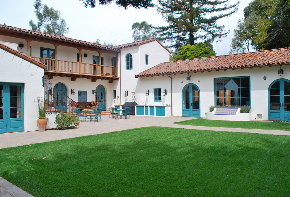 Inspiration for a large mediterranean two-storey exterior in Santa Barbara with a gable roof.
