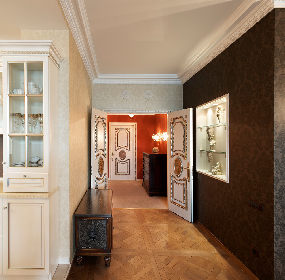 Design ideas for a mid-sized traditional hallway in Yekaterinburg with medium hardwood floors.