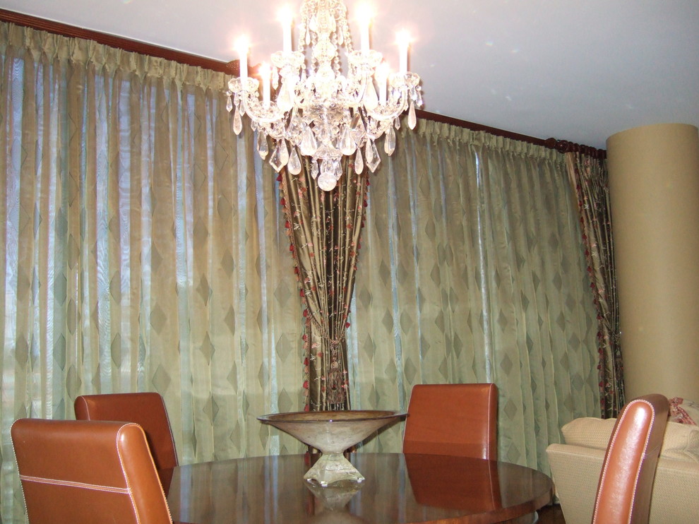 Large traditional dining room in Chicago with beige walls, medium hardwood floors and no fireplace.