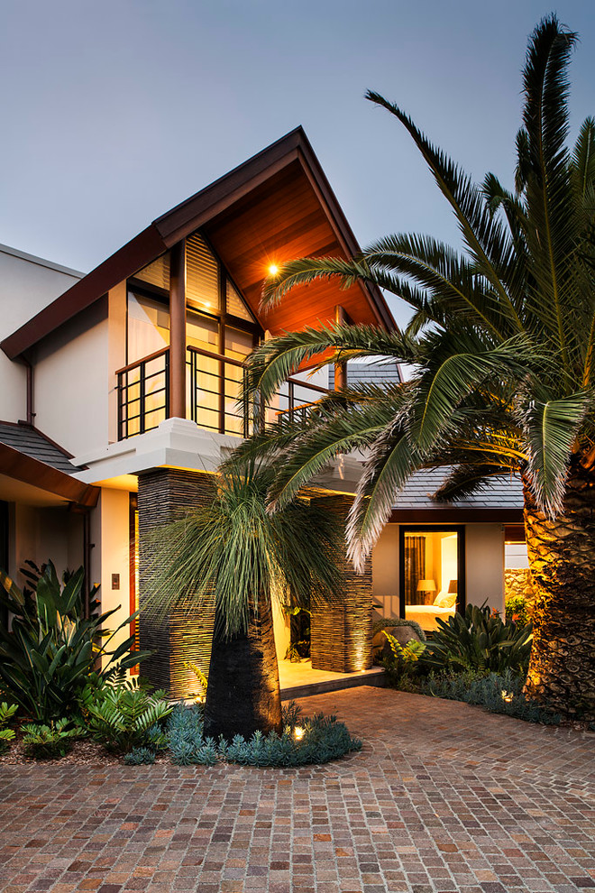 Design ideas for a contemporary two-storey beige exterior in Perth.