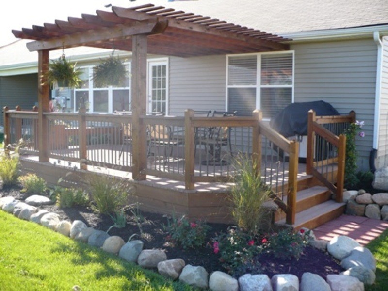 Inspiration for a large traditional backyard deck in Austin with a pergola.