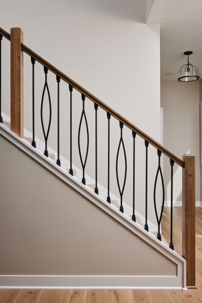 Staircase - mid-sized transitional carpeted l-shaped metal railing staircase idea in Minneapolis with carpeted risers
